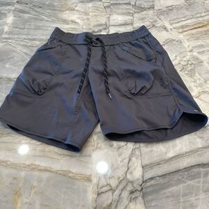 Lululemon dark gray, mid thigh, polyester shorts in size 8
